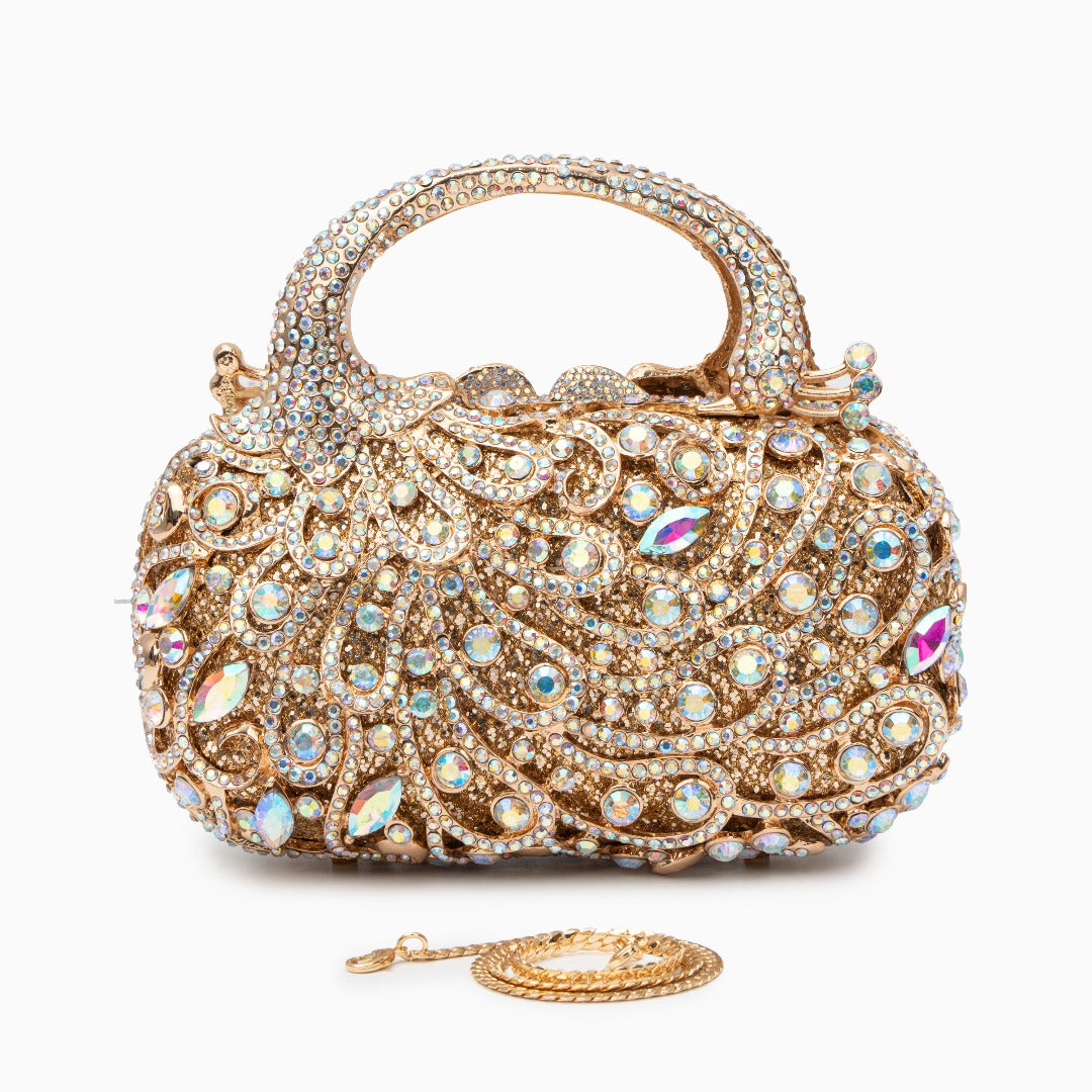 Sac à main doré à strass et motif de volutes