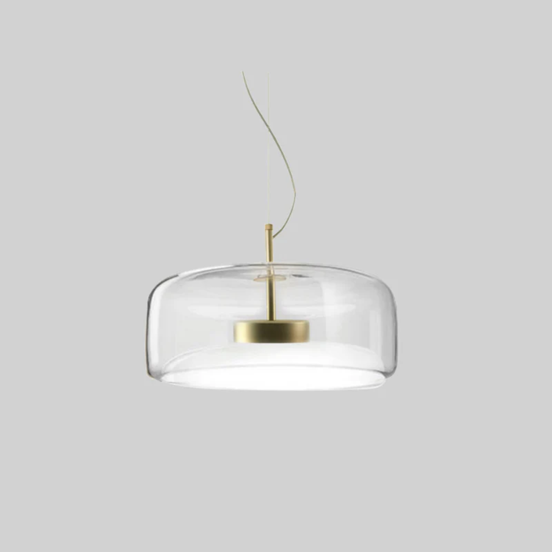 Version épurée du luminaire Éclat en verre clair avec une fixation argentée pour un look sophistiqué.
