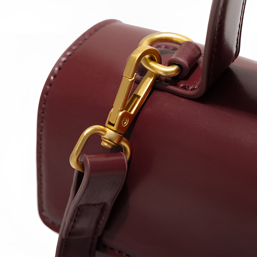 Compact Handbag with Top Handle and Gold Clasp