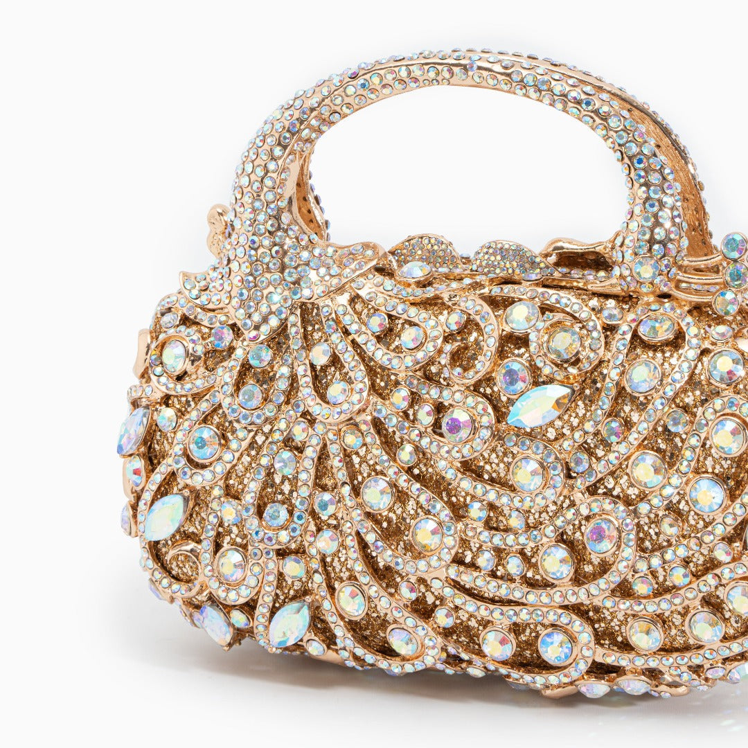 Sac à main doré à strass et motif de volutes