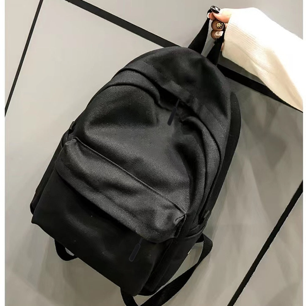 Sac à Dos Noir Minimaliste à Poche Zippée